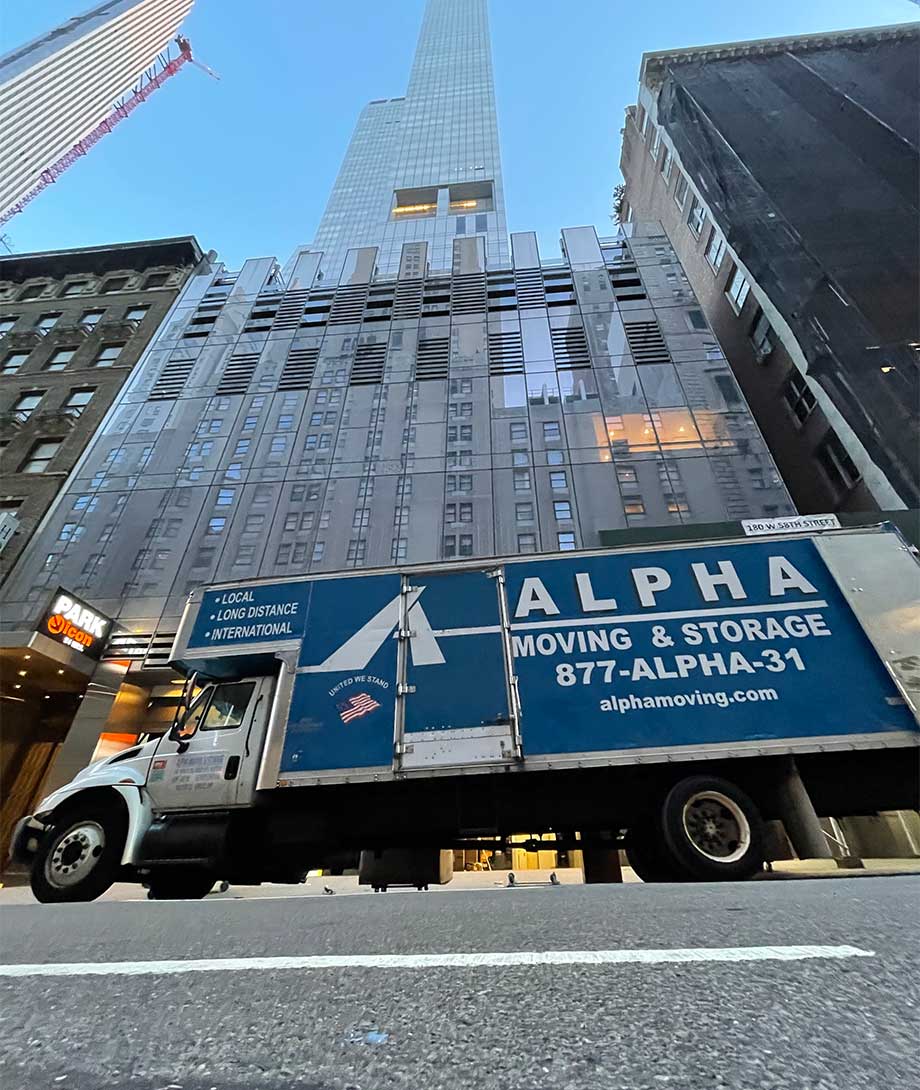 Alpha Moving truck in front of building in New York City